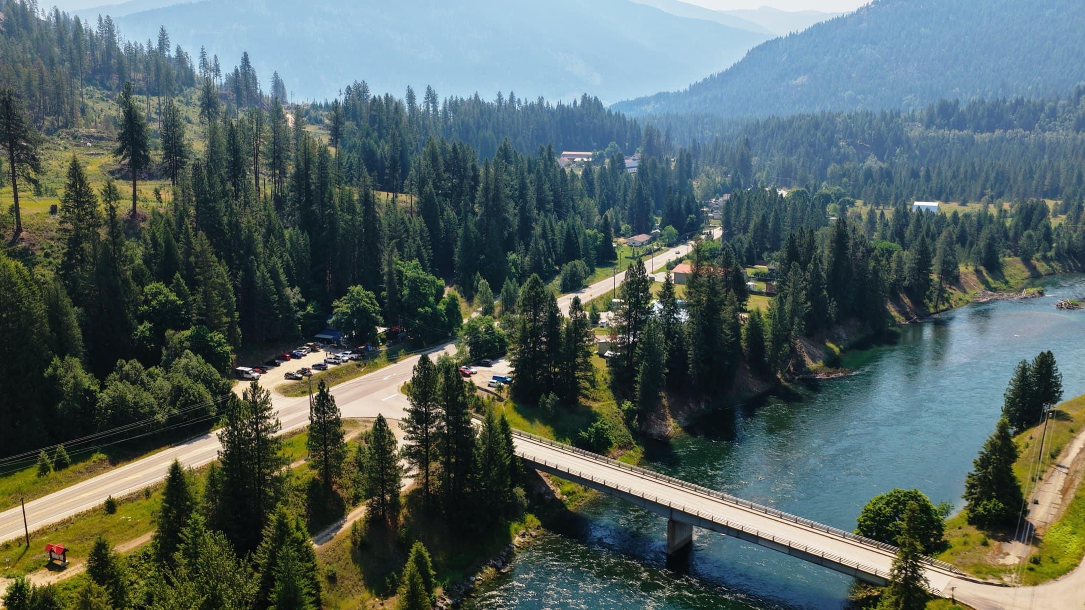 Aerial of the Slocan River, bridge and valley highway