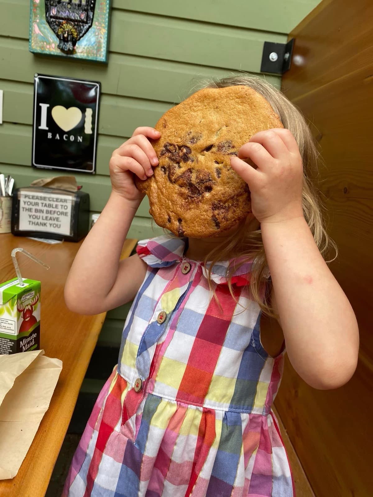 Child holding a giant fresh-baked cookie